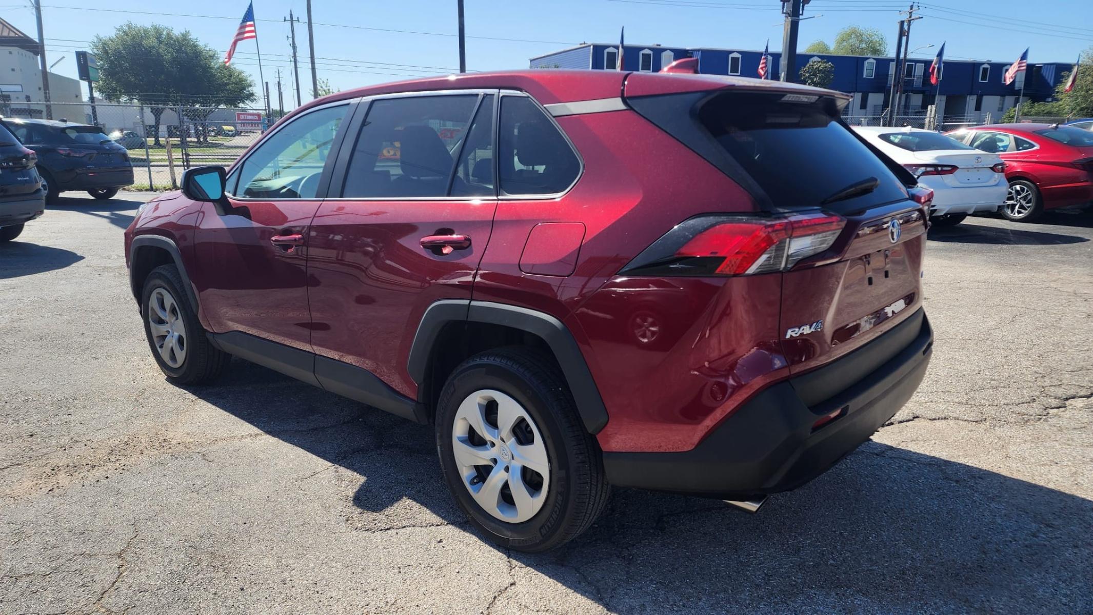 2023 Red Toyota RAV4 LE (2T3H1RFV9PW) with an 2.5L L4 DOHC 16V engine, 8A transmission, located at 1842 Wirt Road, Houston, TX, 77055, (713) 973-3903, 29.805330, -95.484787 - Photo #2